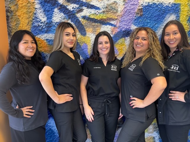 A group photo of the team at Metropolitan Pediatric Dentistry